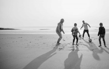 Family playing on beach