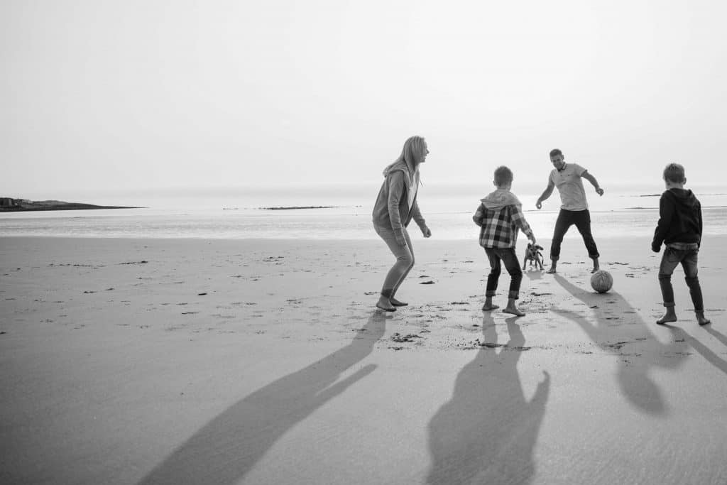 Family playing on beach